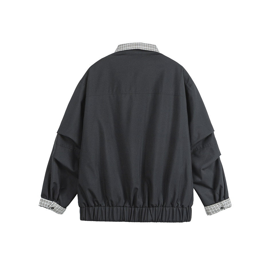 Back view of a black jacket with a gathered hem and black-and-white checked collar and turned-back cuffs.