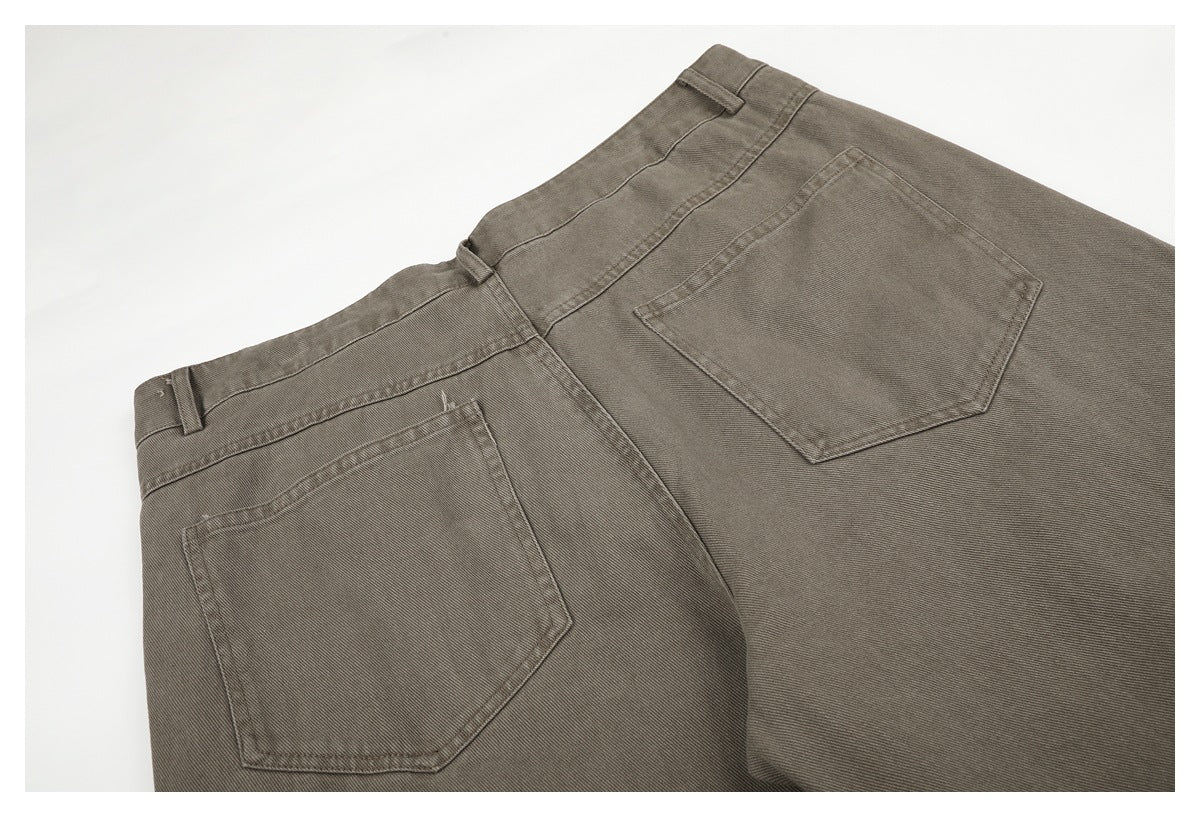 Back view of taupe-gray trousers laid flat, showing two patch pockets, belt loops, and the waistband.