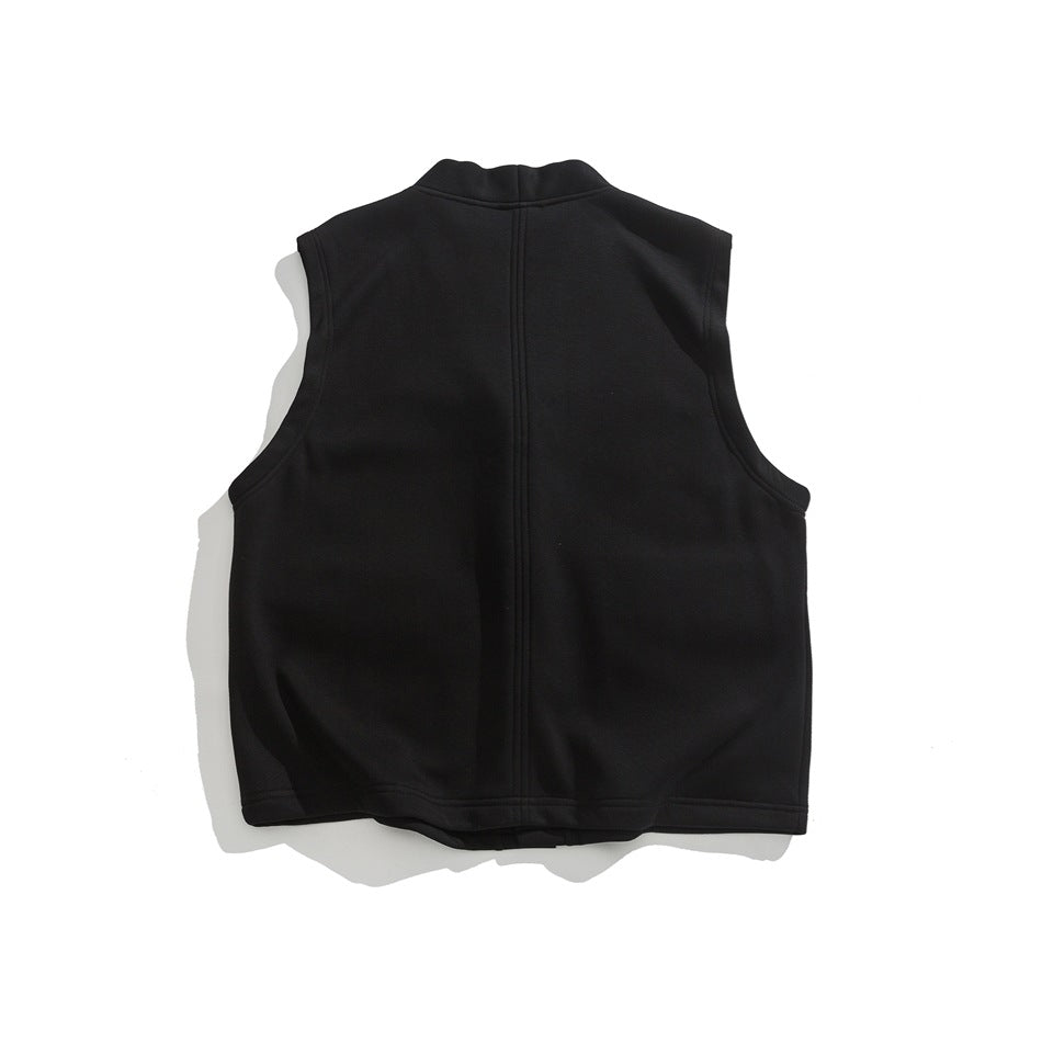 Back view of a black sleeveless vest laid flat, with a raised collar and a center seam.