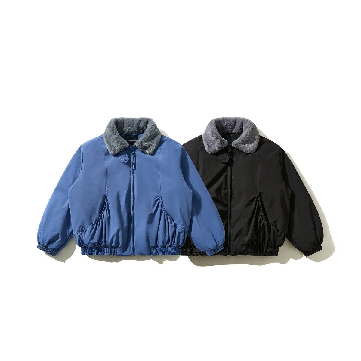 Blue and black jackets shown from the front, each with a gray plush collar and gathered details.