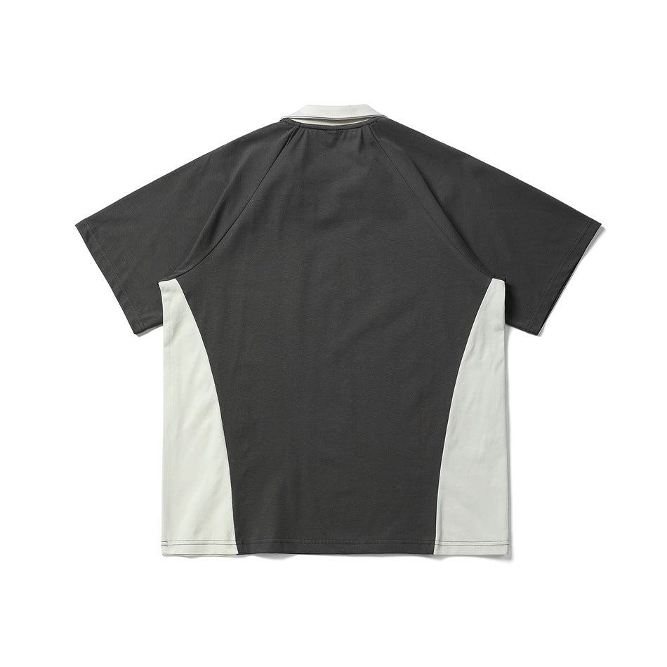 Back view of a short-sleeve color-block shirt with a charcoal body, white side panels, and white collar.