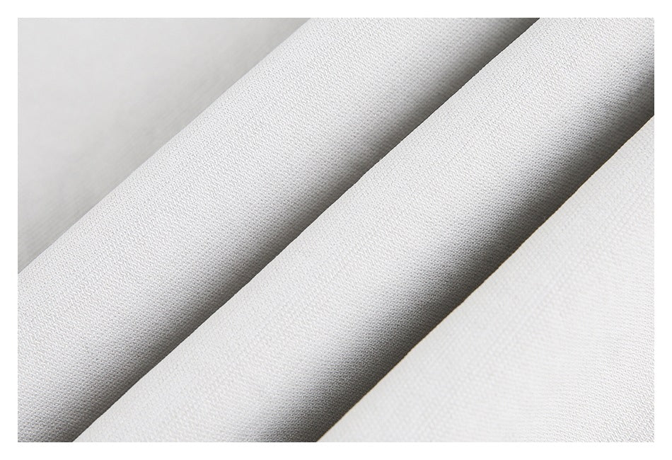 Close-up of light gray fabric texture arranged in soft folds.