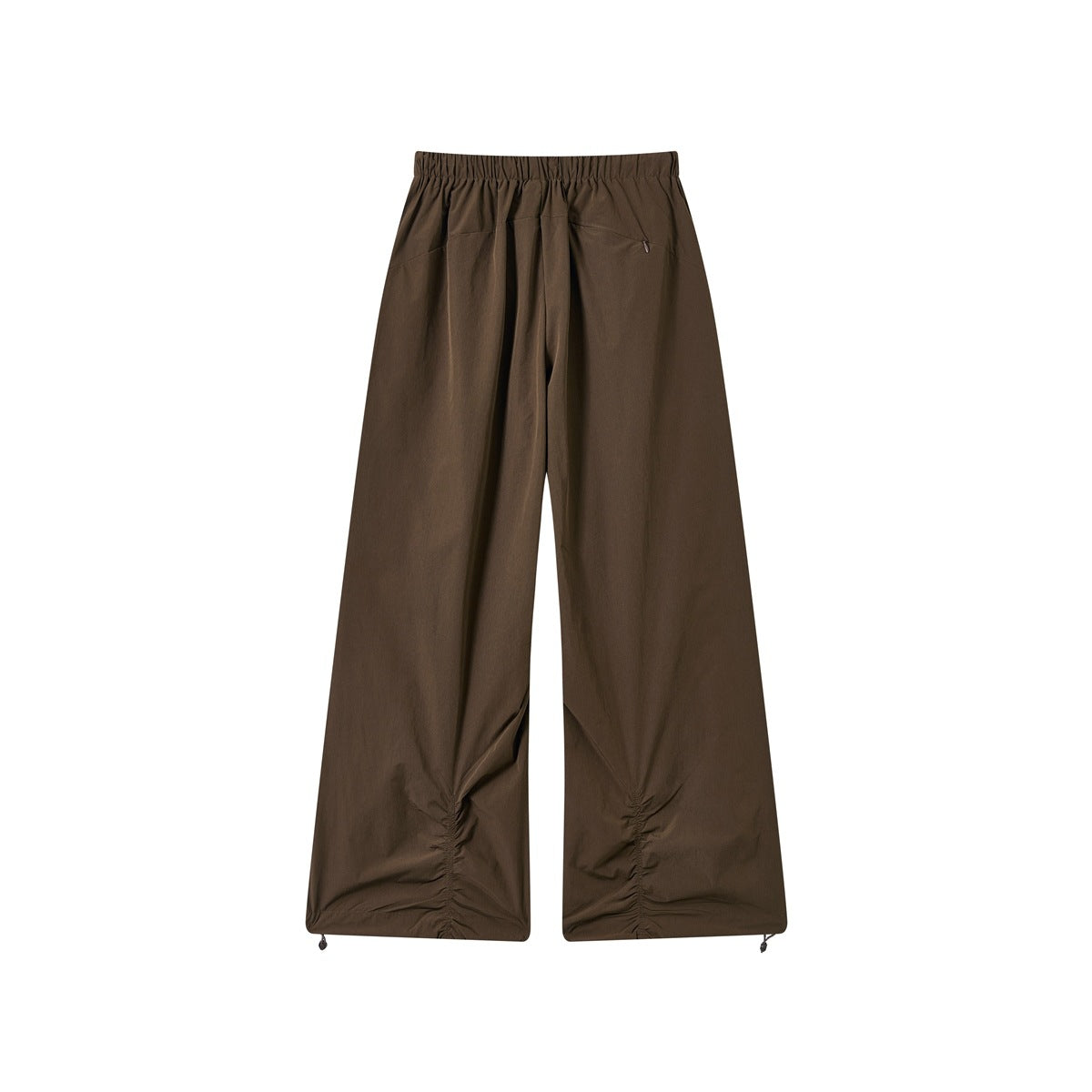 Back view of dark brown wide-leg trousers with an elastic waistband, rear pocket and gathered adjustable hems.