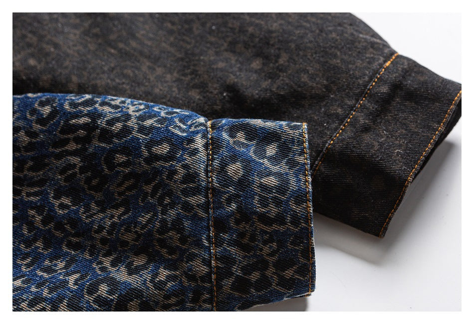 Close-up of a blue and charcoal leopard-print denim cuff beside a dark reverse side, with orange stitching.