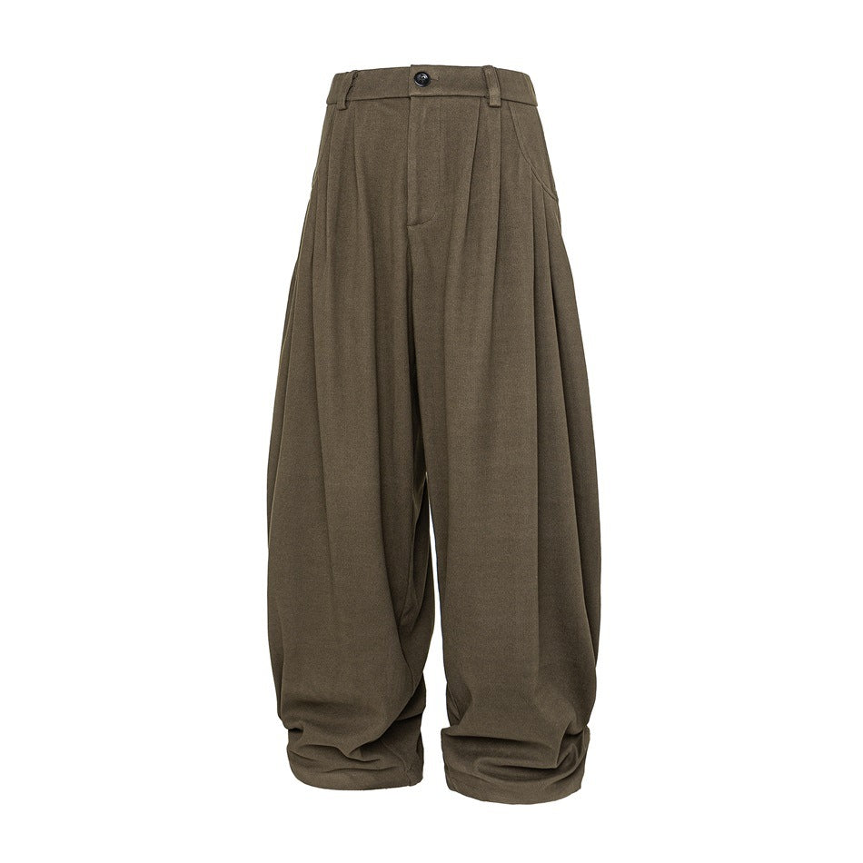 Brown pleated wide-leg balloon trousers, front view, with button closure, belt loops, and gathered hem