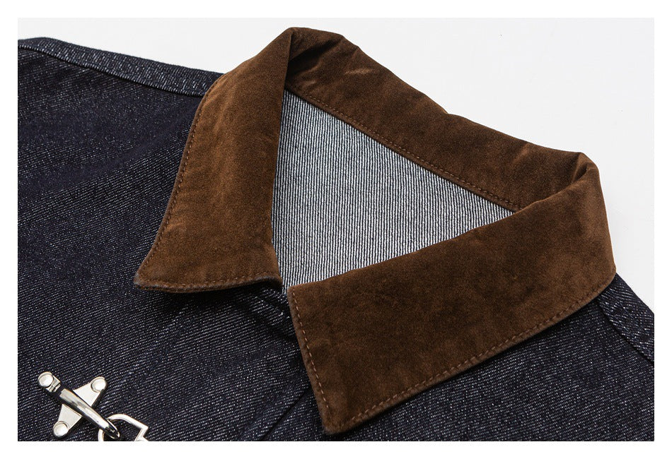 Close-up of the jacket's brown collar, dark indigo fabric, and metal clasp.