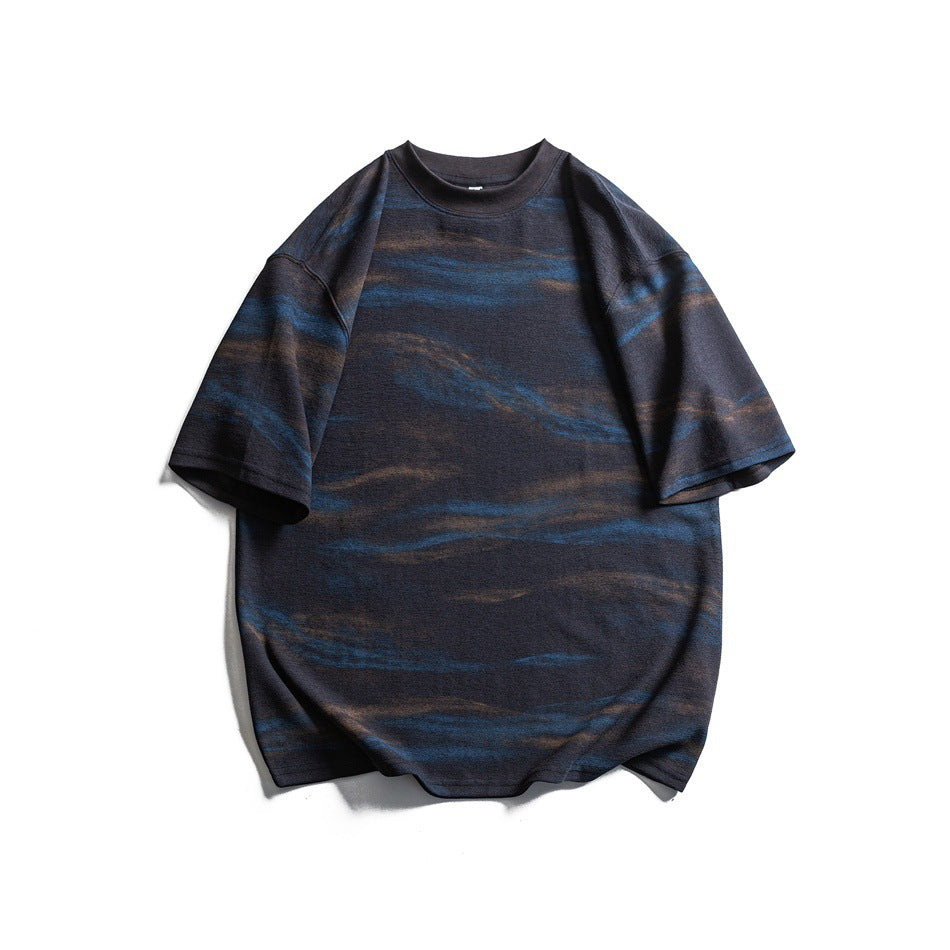Dark gray short-sleeve crew neck T-shirt with blue and brown brushstroke pattern, flat lay front view