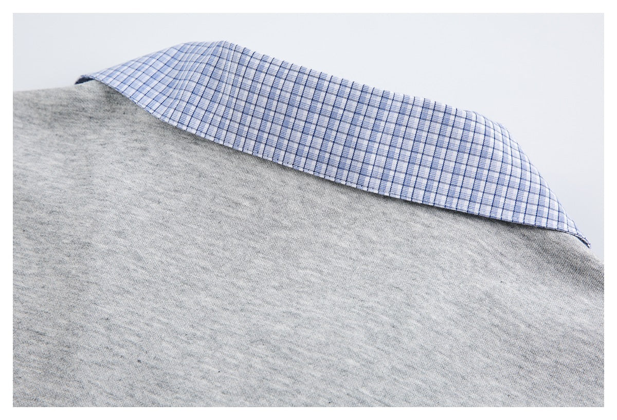 Close-up of a blue-and-white checked collar attached to a light gray heathered knit garment.