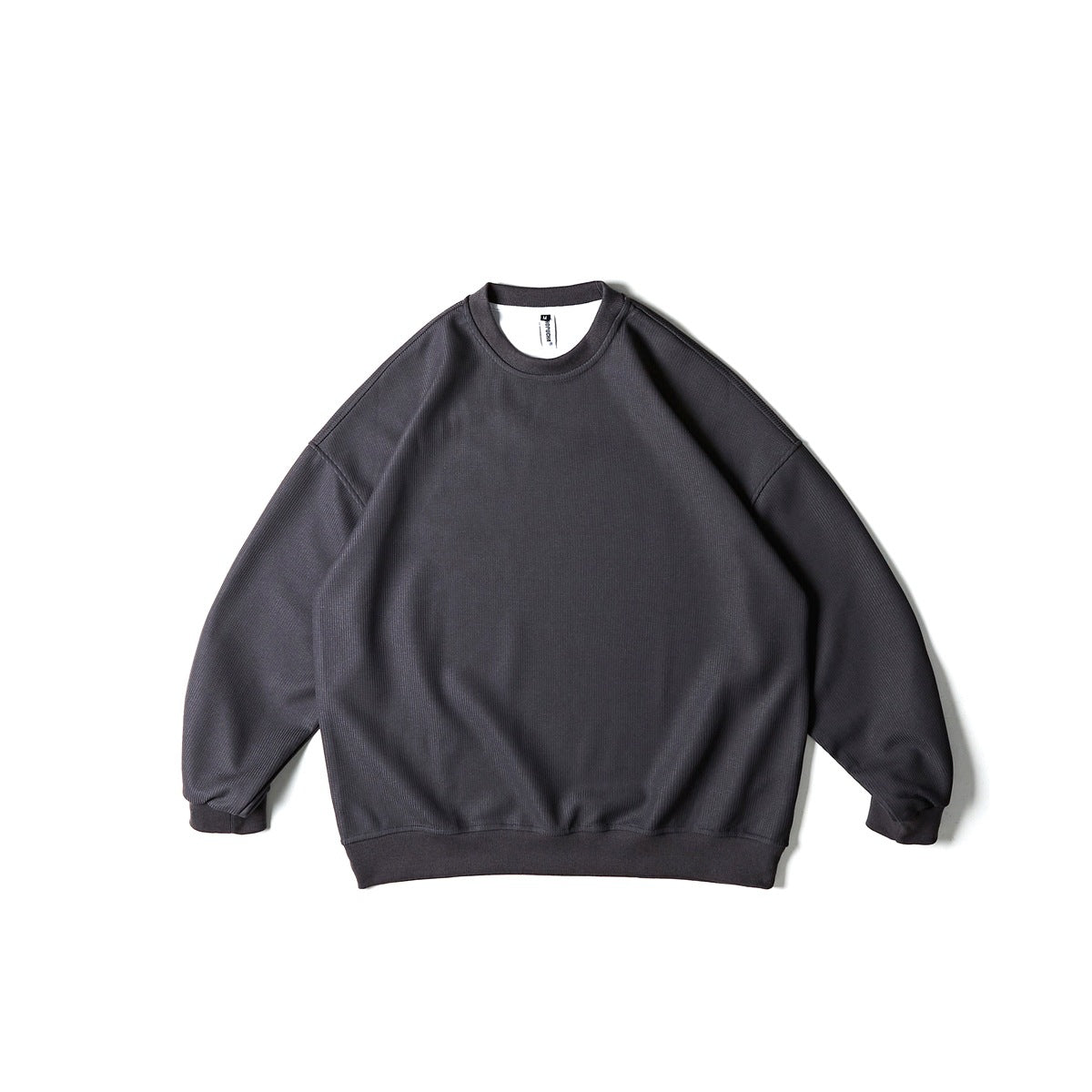 Dark gray crew neck sweatshirt with fine rib texture and ribbed trim, flat lay front view