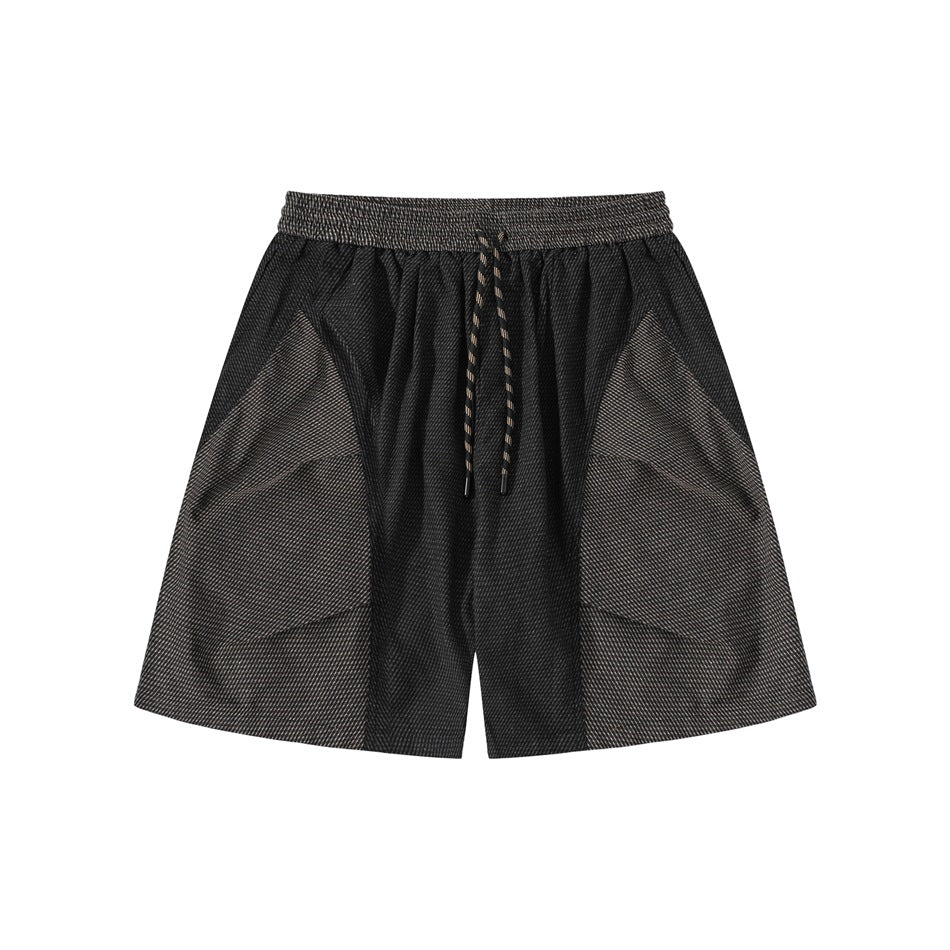 Black textured shorts with brown-gray front side panels and a drawcord elastic waistband, front view
