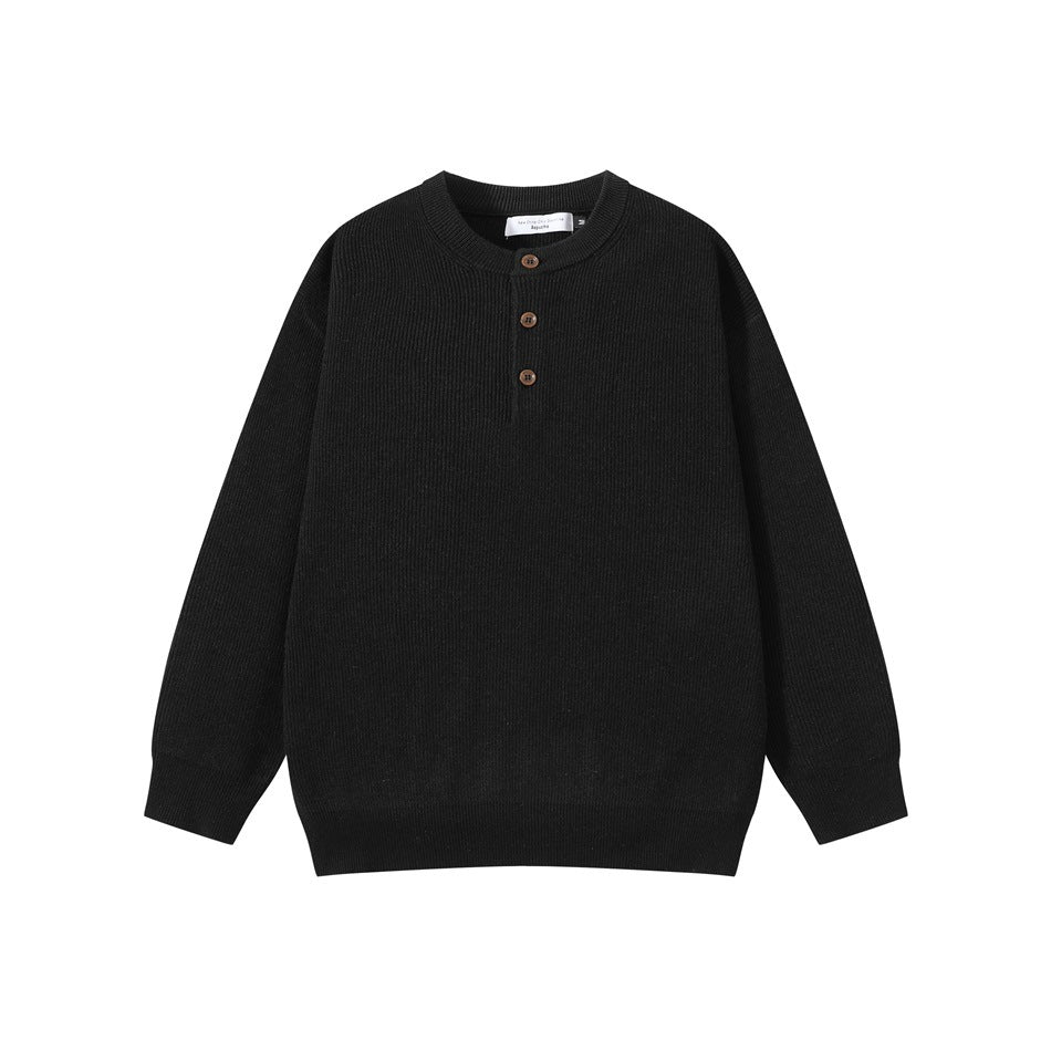Black ribbed knit henley sweater with three brown buttons, flat lay front view