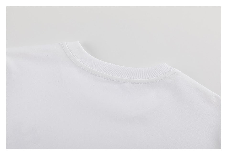 Close-up of the ribbed crew neckline on a plain white T-shirt.