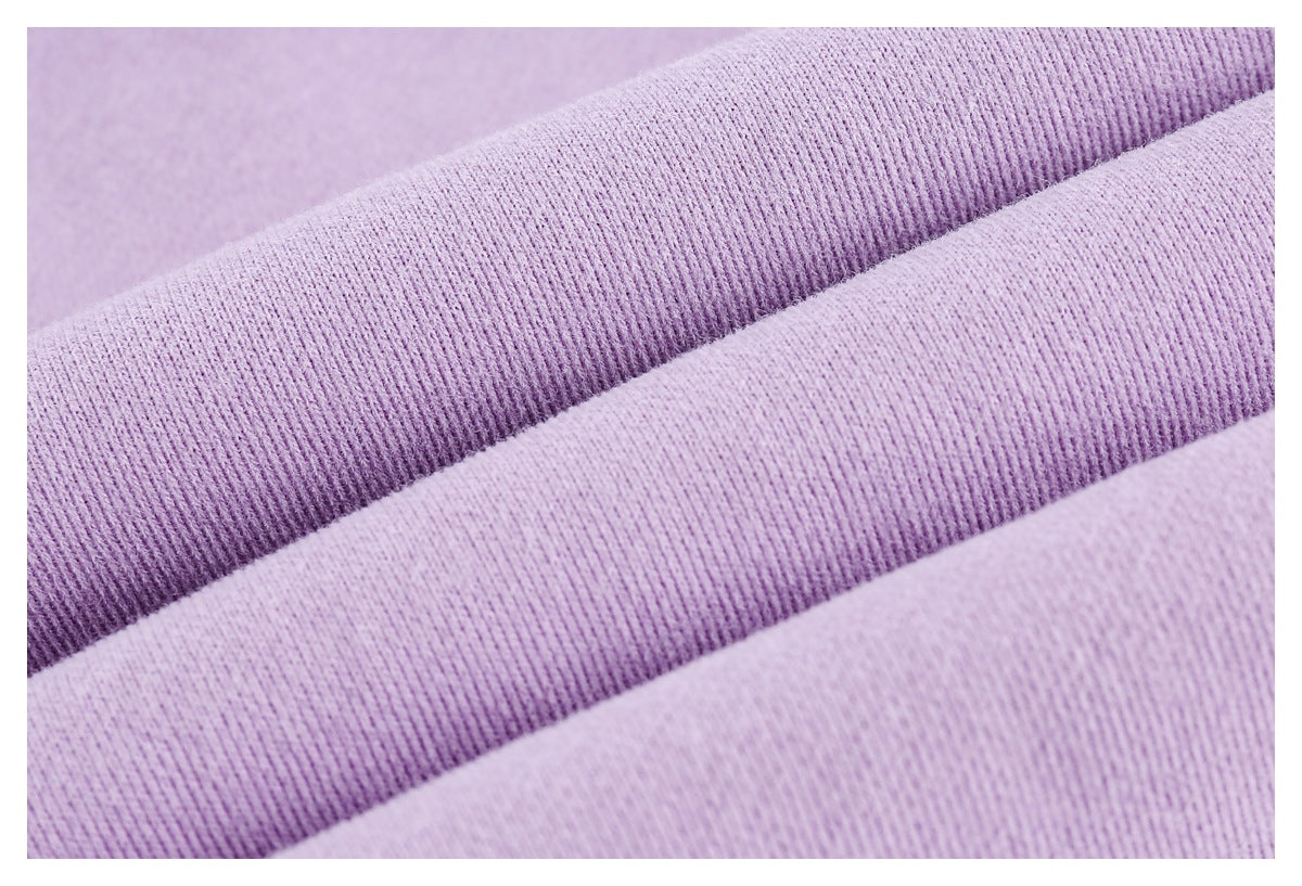 Macro view of lilac ribbed fabric texture.