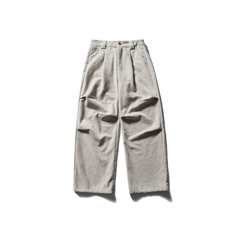Beige corduroy-textured wide-leg trousers, front flat lay with pleats, button waistband and side pockets