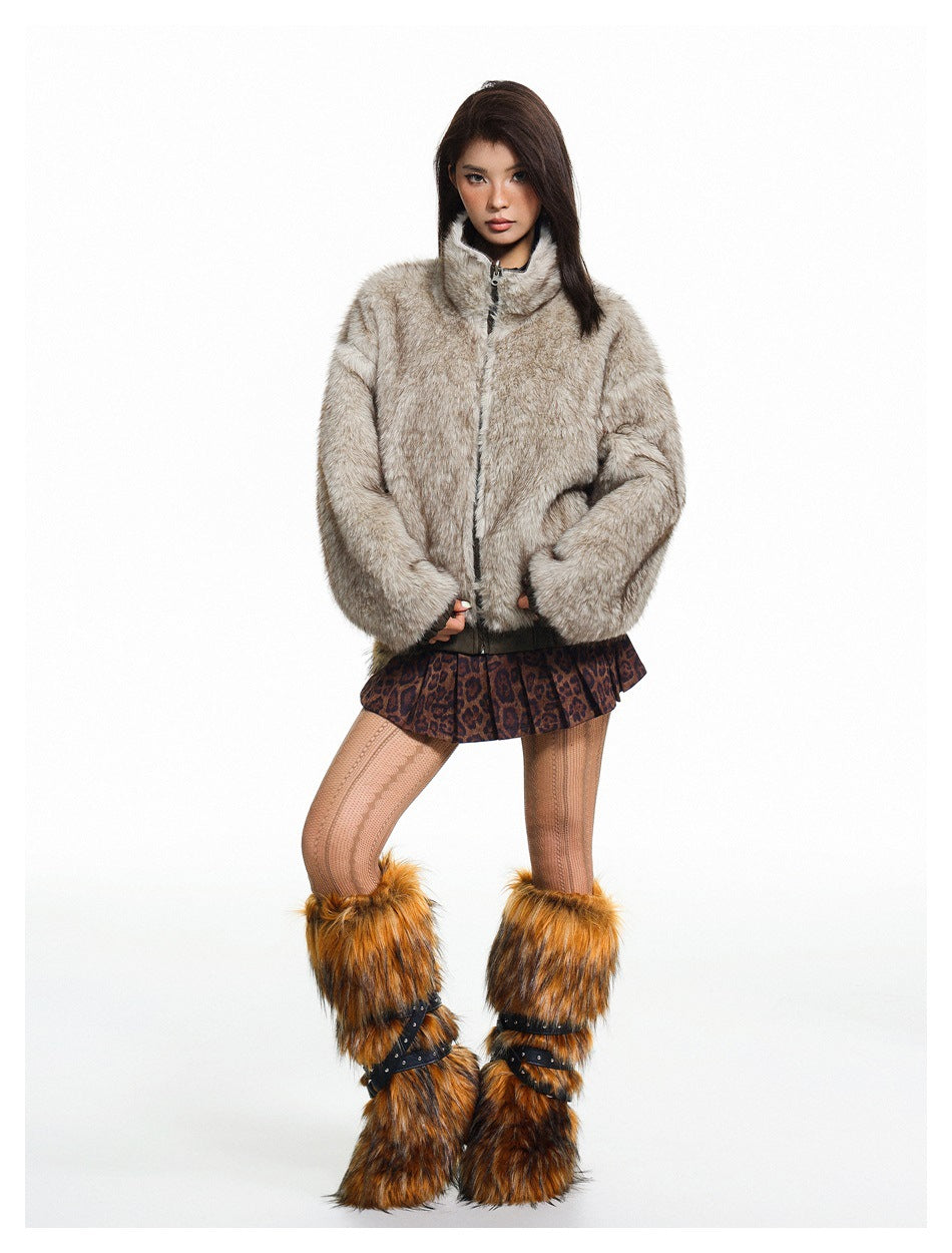 Full-length model wearing a pale gray-brown fuzzy zip jacket with a stand collar and dark trim.