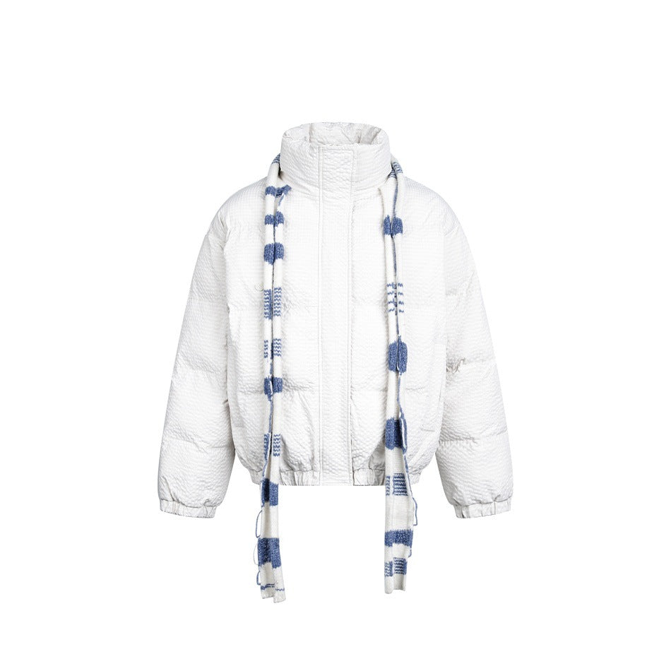 White quilted puffer jacket with stand collar and long blue and white striped scarf, front view