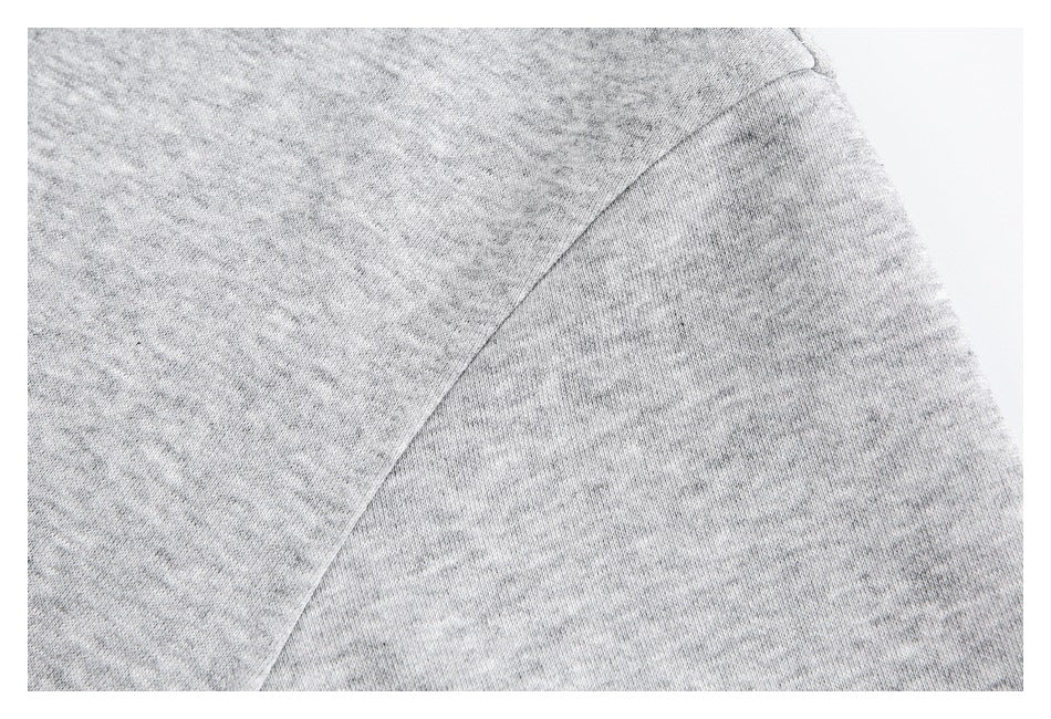 Close-up of the gray shirt's shoulder and sleeve seam.