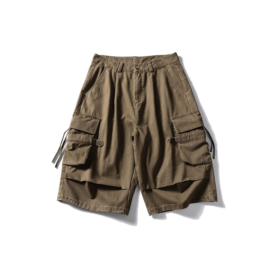 Brown knee-length cargo shorts, front view, with large flap side pockets, drawcord ties and button waist
