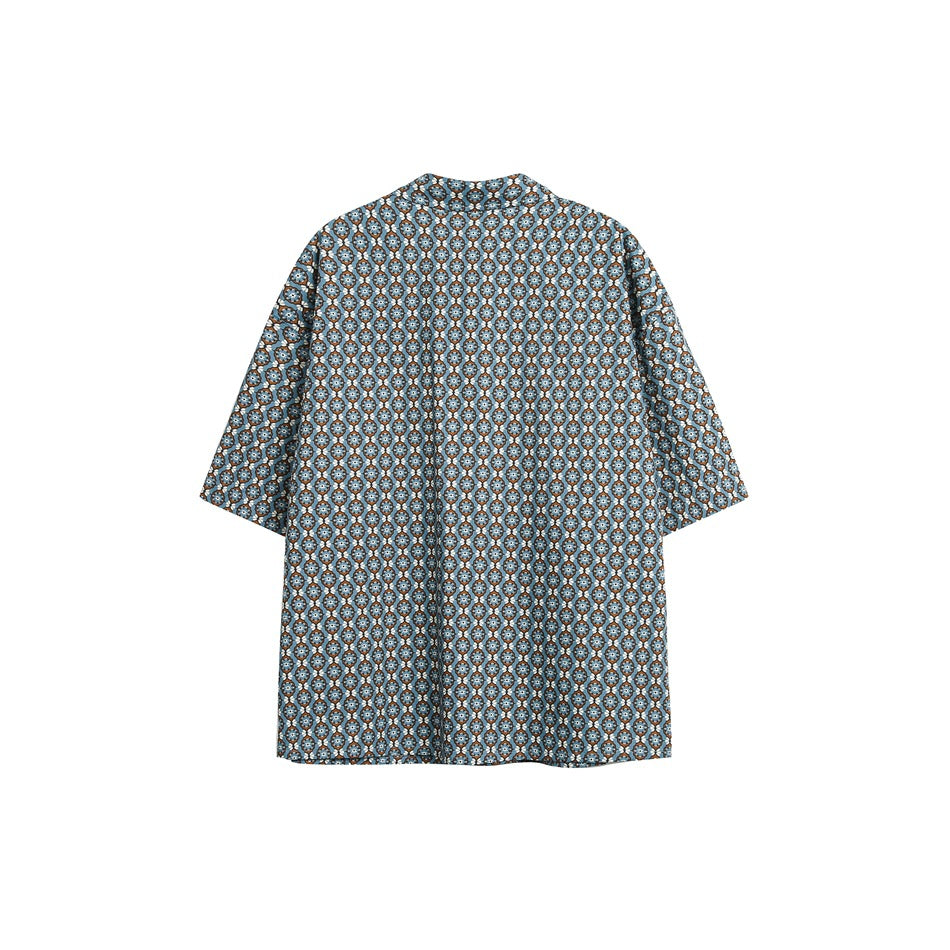 Back view of a blue short-sleeve button-up shirt with a repeating light blue, white, and brown floral pattern.