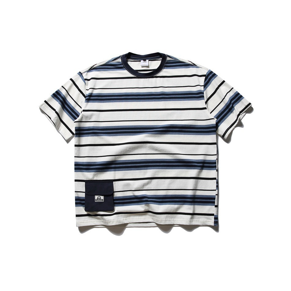Navy, black and blue striped off-white short-sleeve T-shirt with navy collar and flap pocket, flat lay front view