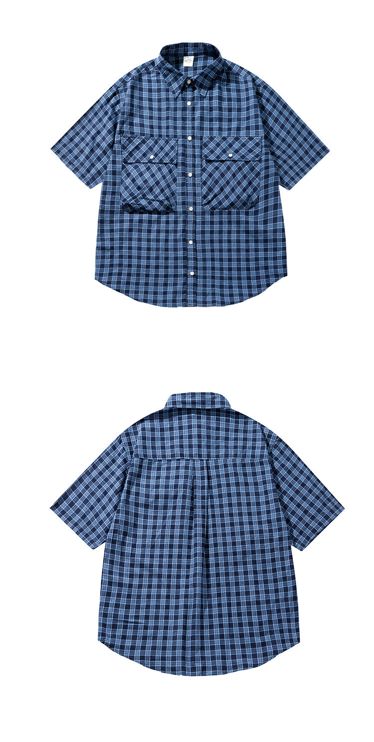 Flat-lay views of the navy plaid shirt from the front and back; the front has two large flap pockets.