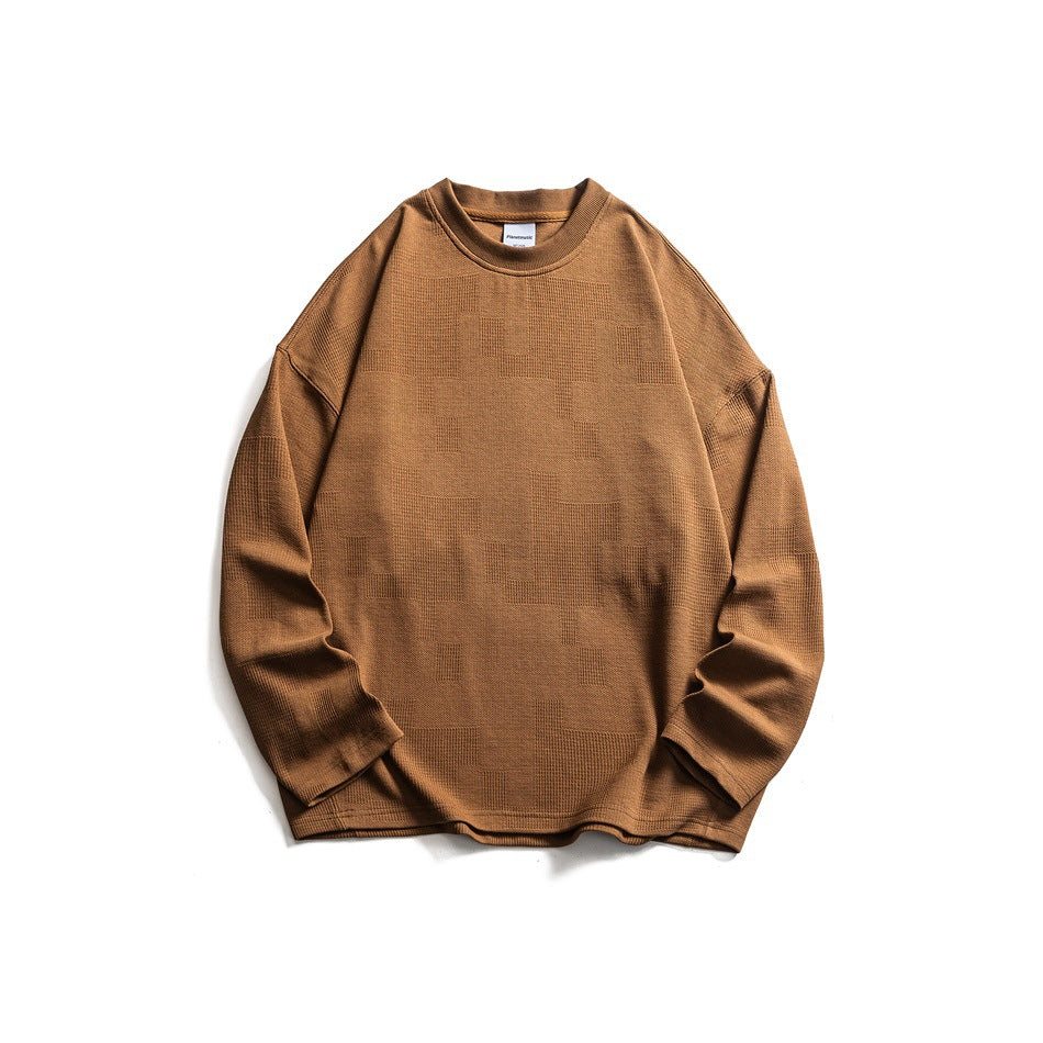 Brown long-sleeve crew-neck sweatshirt flat lay with drop shoulders and textured block pattern