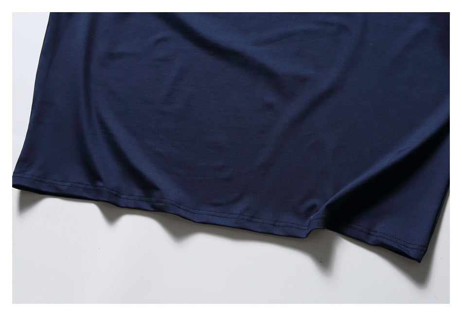 Close-up of the navy shirt's bottom hem with double stitching.