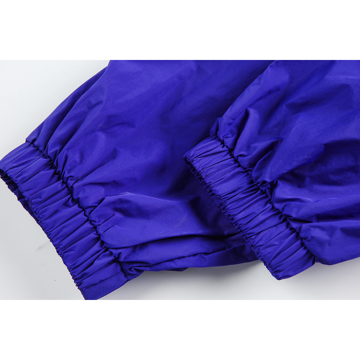 Close-up of a blue jacket's gathered elastic cuffs and sleeves.