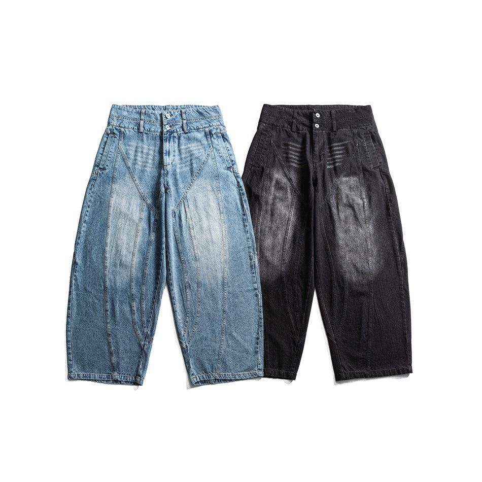Two pairs of wide-leg jeans shown from the front: light blue denim and washed black, both with curved panel seams.