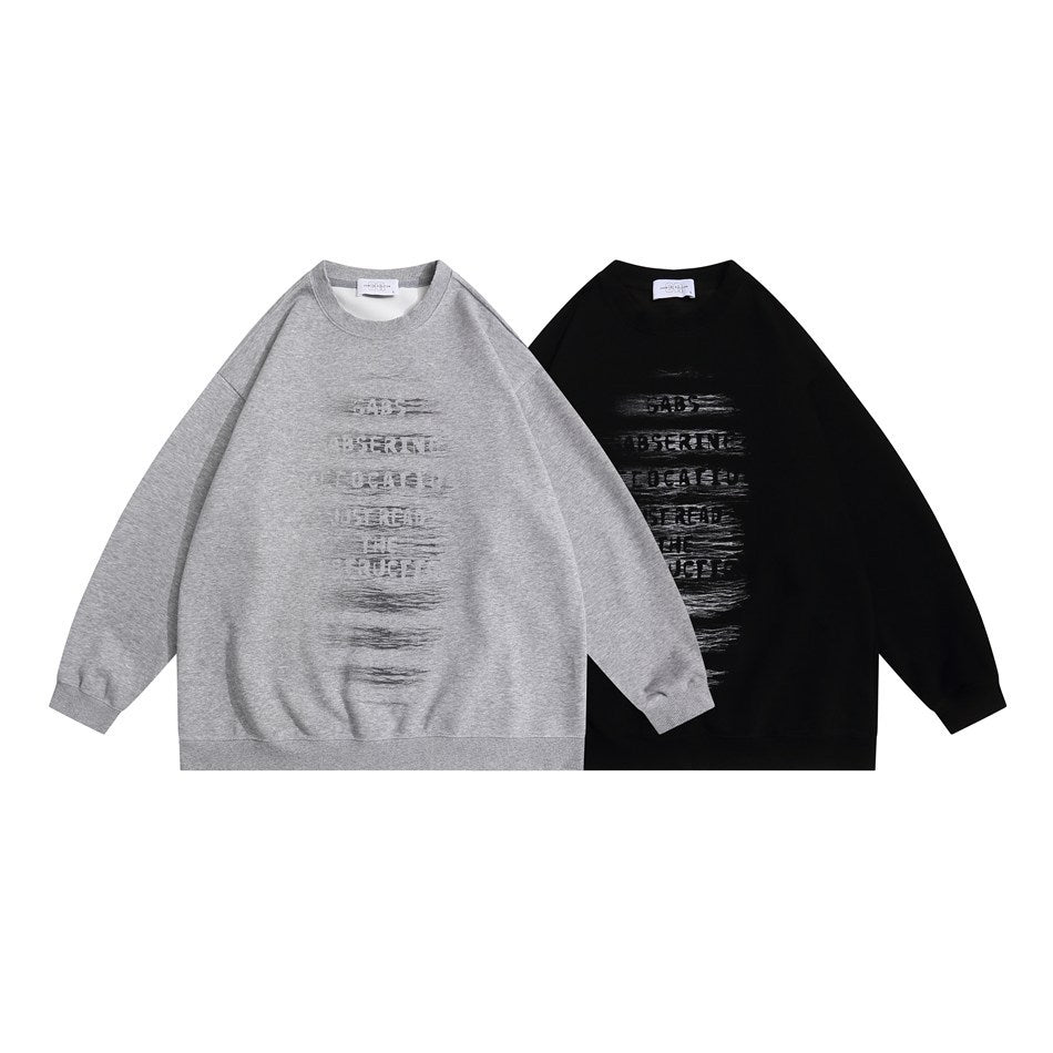 Front view of two crewneck sweatshirts, one heather gray and one black, with distressed chest lettering.