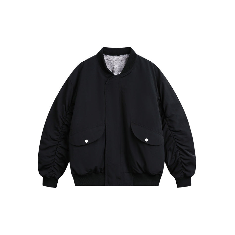Black bomber jacket front with ribbed collar, concealed placket, snap flap pockets and ruched sleeves