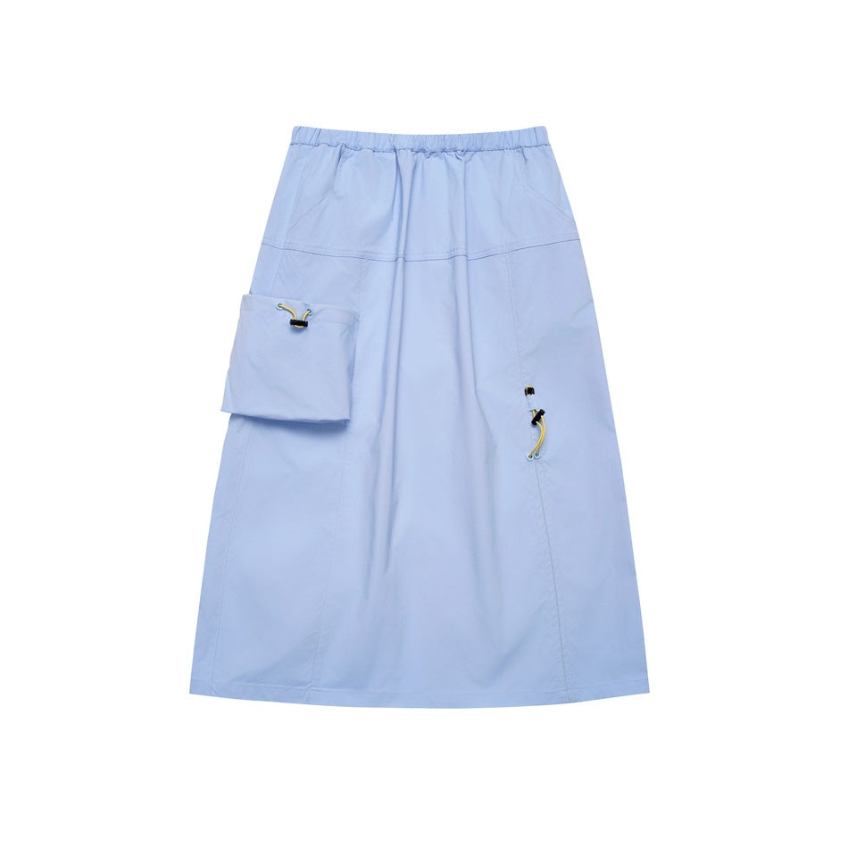 Light blue A-line midi skirt with elastic waist, large patch pocket and yellow toggle drawcords, flat lay front view