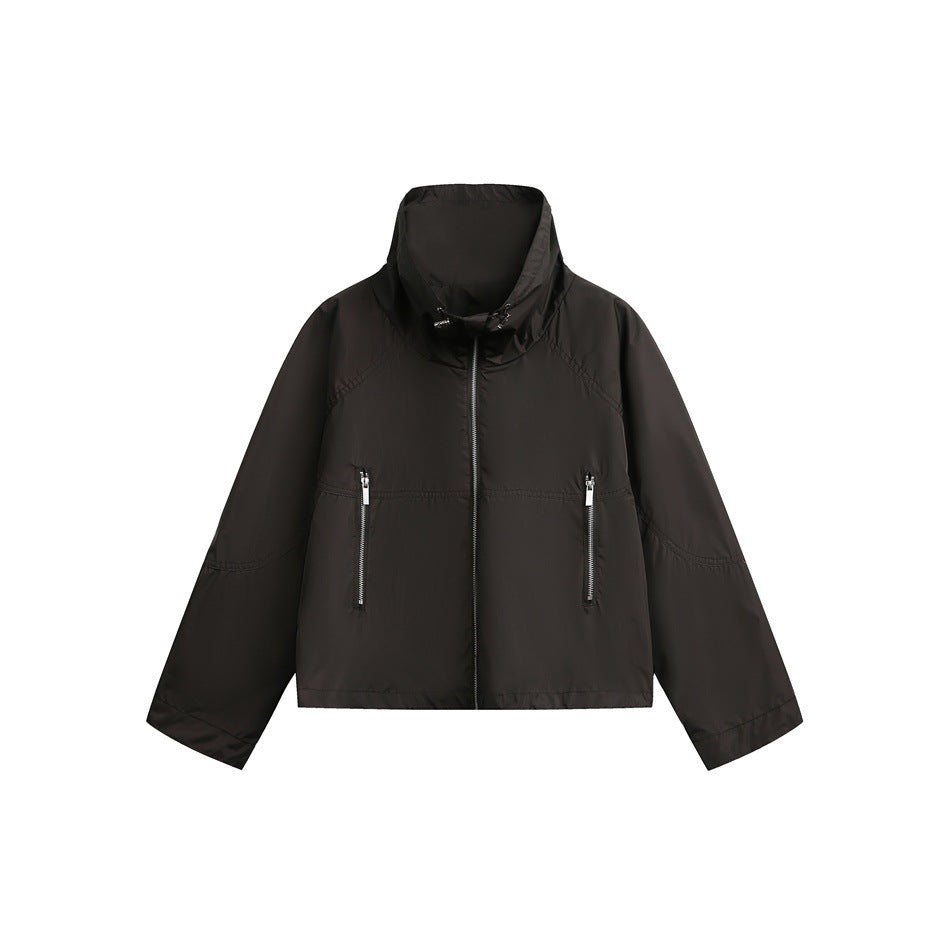 Brown cropped zip-up jacket with high drawcord collar and two zippered front pockets, flat lay on white