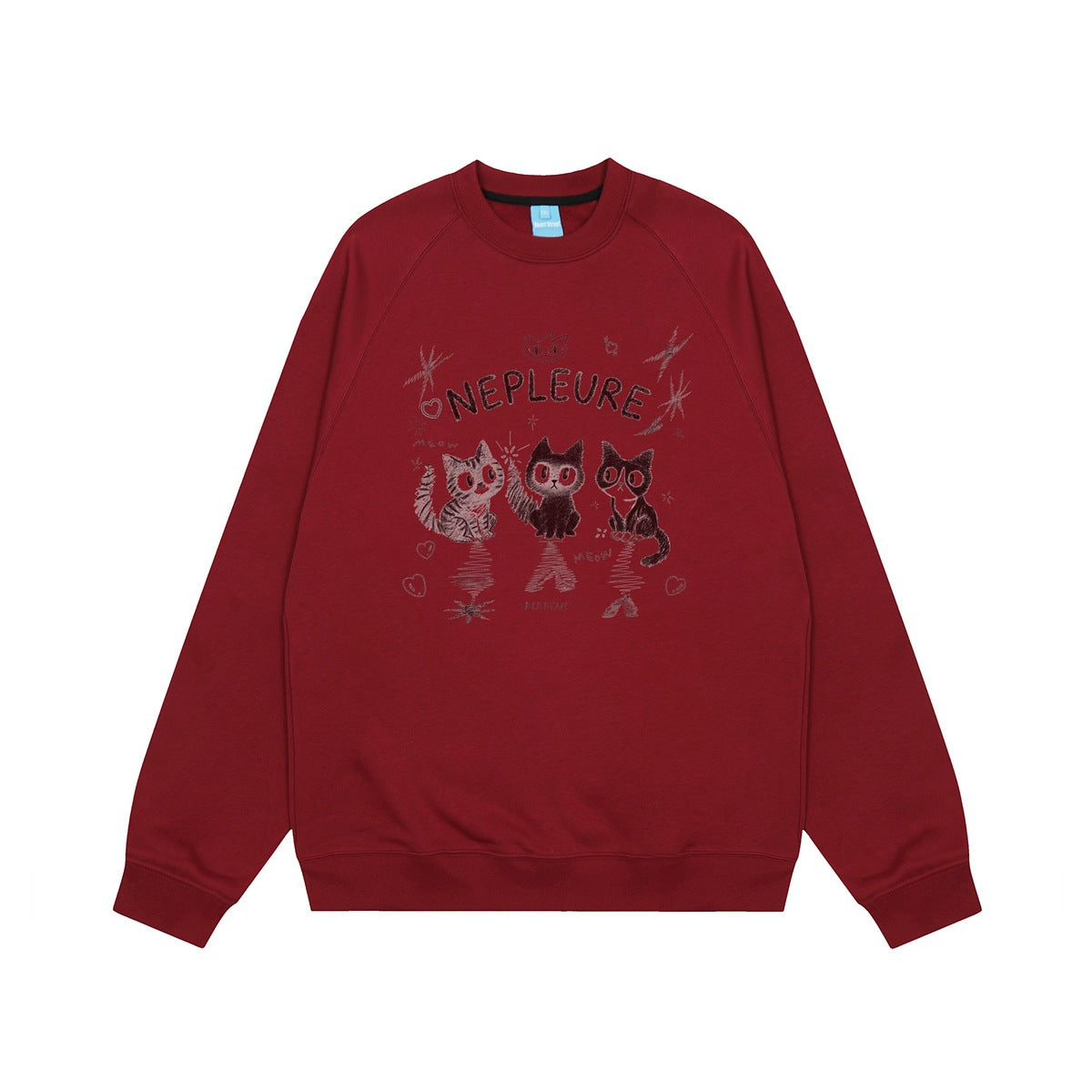 Burgundy crew-neck raglan sweatshirt flat lay with a three-cat sketch print and NEPLEURE lettering