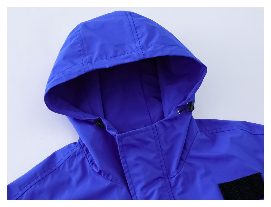 Close-up of the jacket's blue hood, drawcord toggles and upper shoulder.
