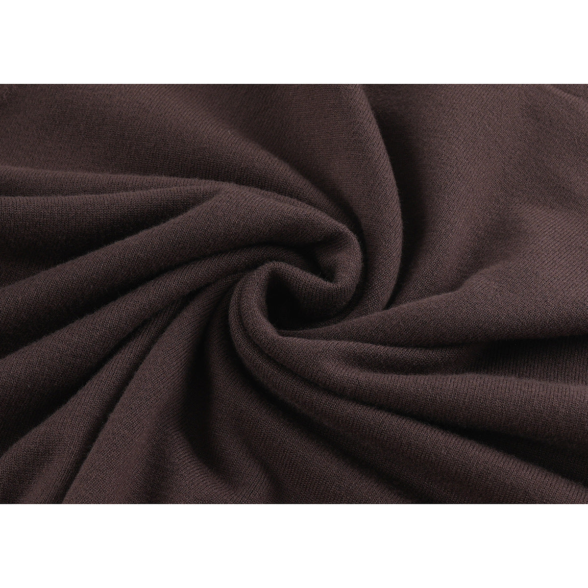 Close-up showing the dark brown sweater's knit texture and draped fabric.
