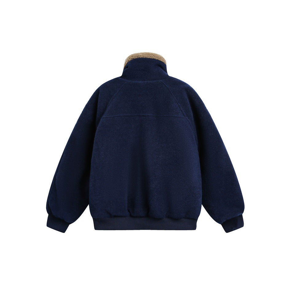 Back view of a navy jacket with a tan fleece collar, raglan sleeves and ribbed cuffs and hem.