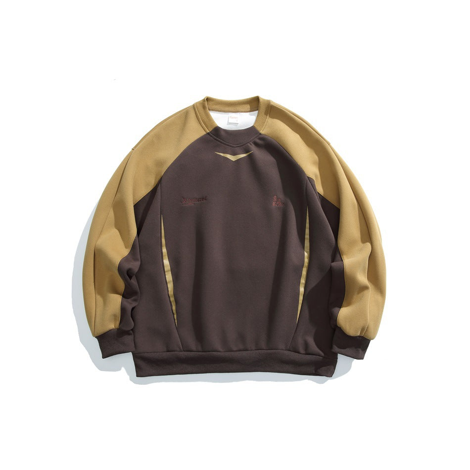 Coffee brown crewneck sweatshirt with mustard tan raglan sleeves, ribbed trim and tonal chest embroidery, flat lay
