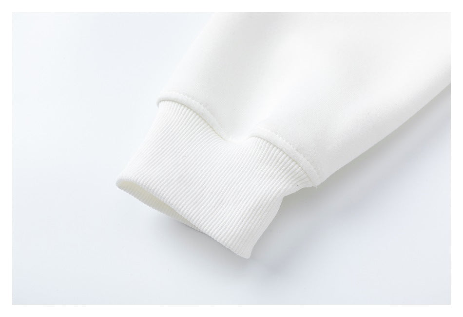 Close-up of a white sleeve ending in a ribbed cuff.
