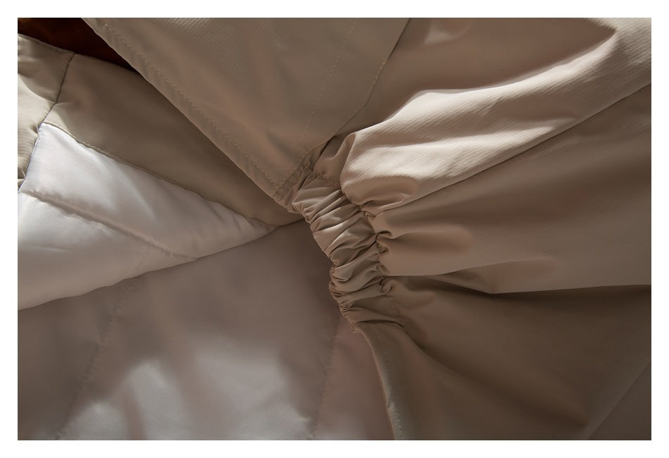 Interior close-up showing beige lining and a gathered seam.