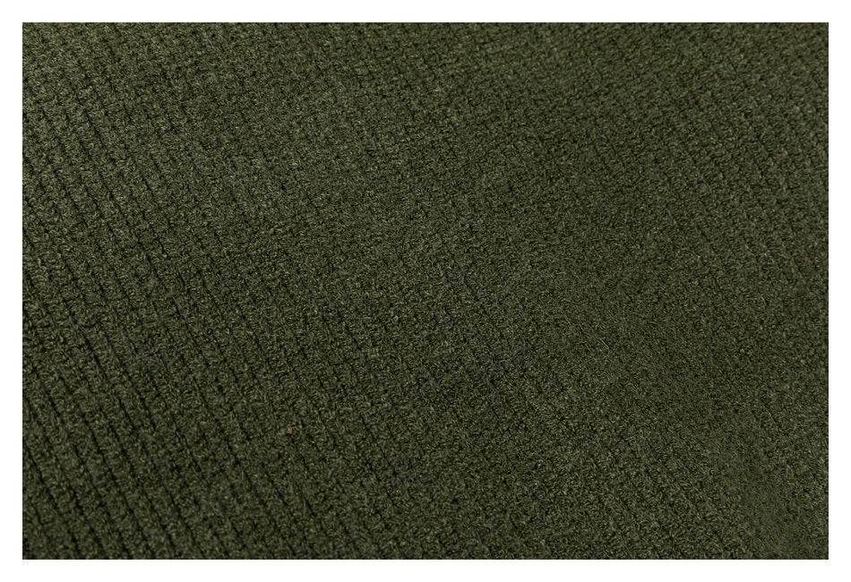 Close-up of the olive sweater's knit surface, showing a transition from ribbed to finer texture.