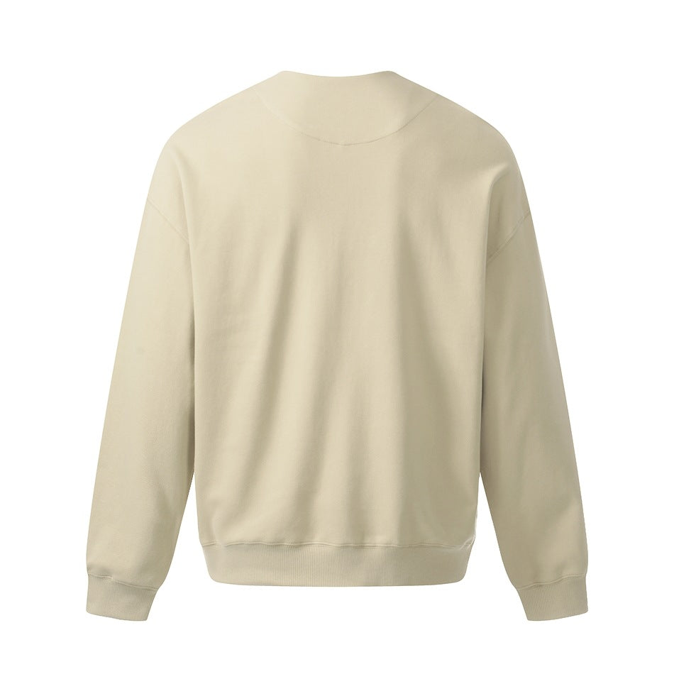 Back view of a light cream long-sleeve top with a round neckline and ribbed cuffs and hem.