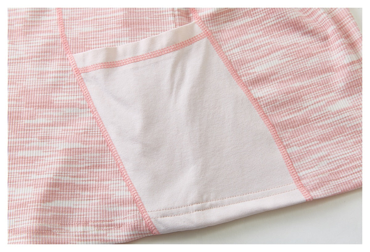 Close-up of pink-and-white plaid fabric with a large plain white panel and pink overlock stitching.