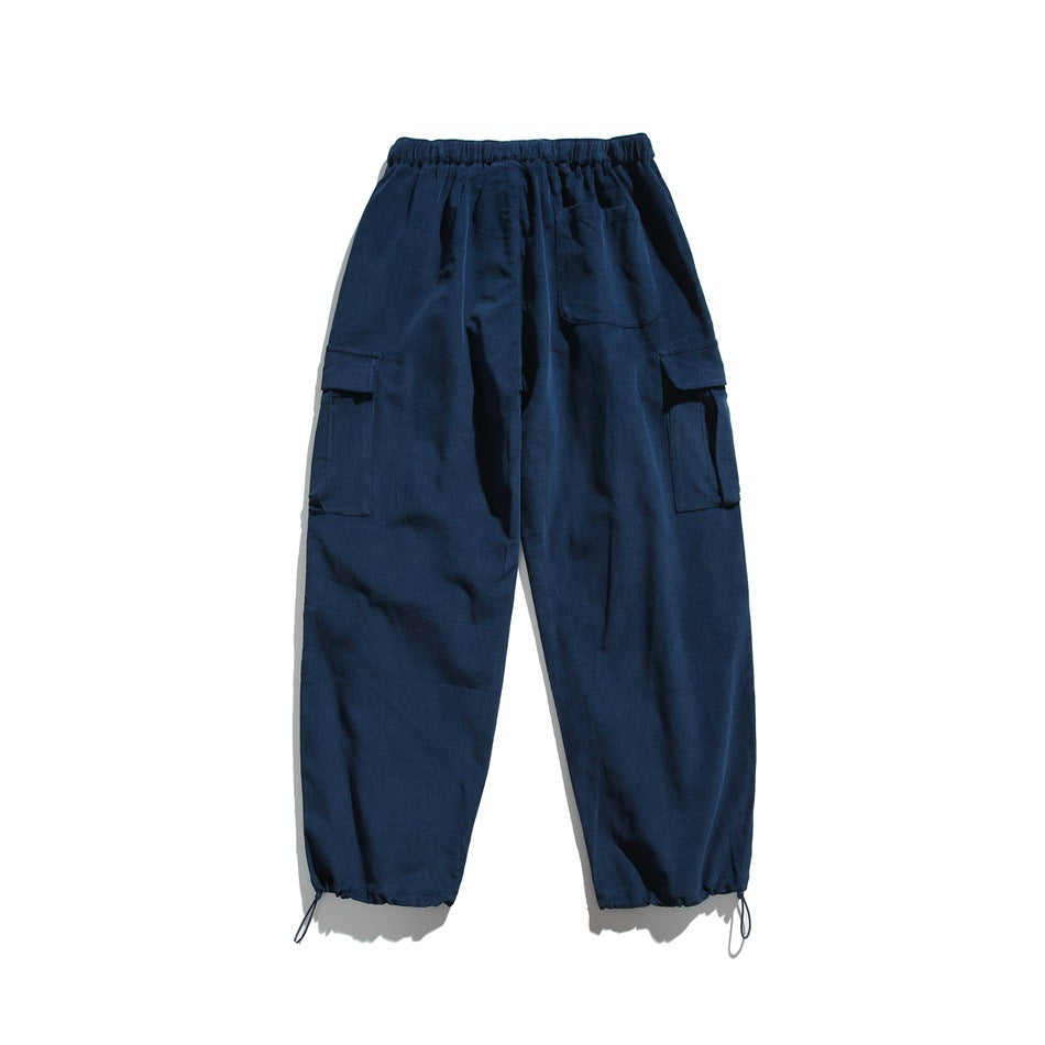 Back view of lake blue cargo pants with elastic waist, back patch pocket, side flap pockets and toggle hems