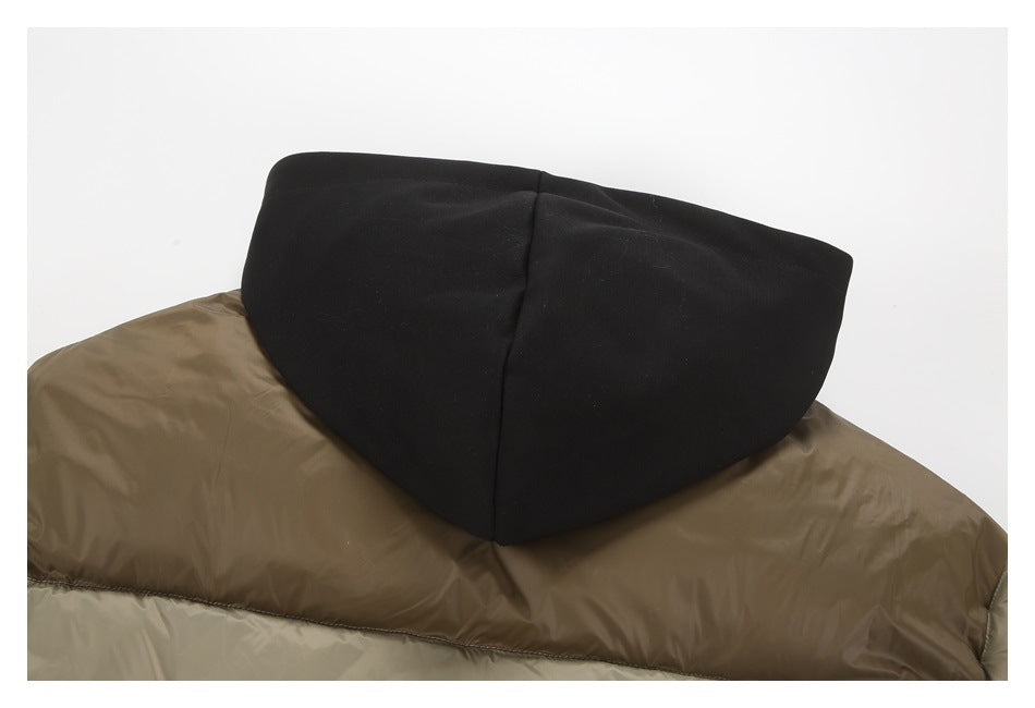 Close-up of the jacket's black hood resting above its taupe quilted shoulder panel.