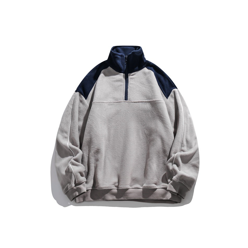 Gray half-zip fleece-texture pullover with navy collar and shoulder yoke, white sleeve piping, front view