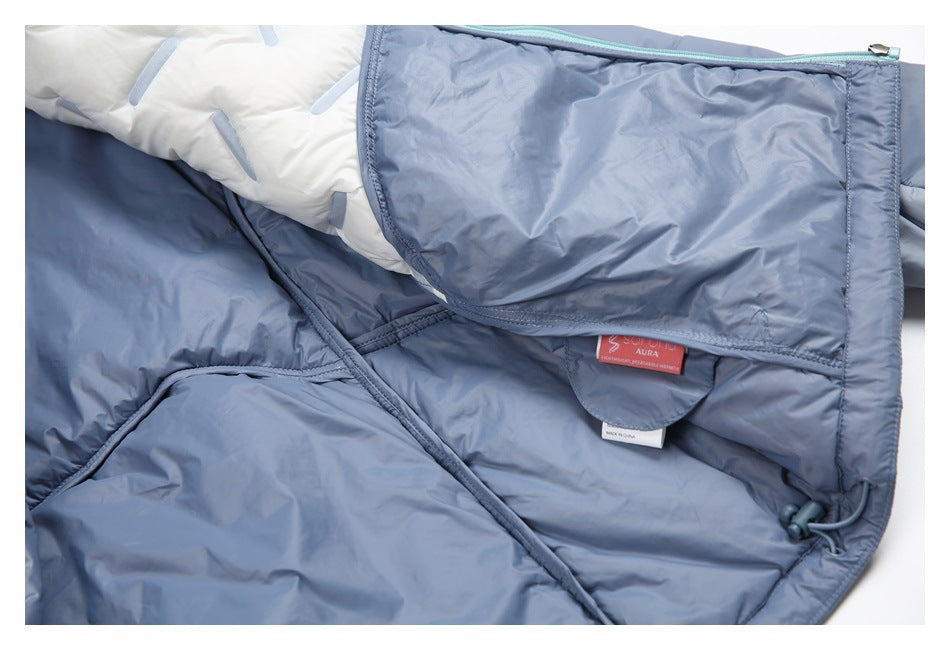 Open blue-gray jacket showing its pale lining, turquoise zipper, drawcord, and sewn-in labels.