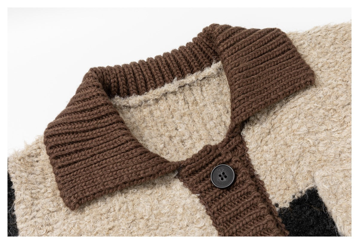 Close-up of brown ribbed knit collar and button placket against beige fleece-like textured knit