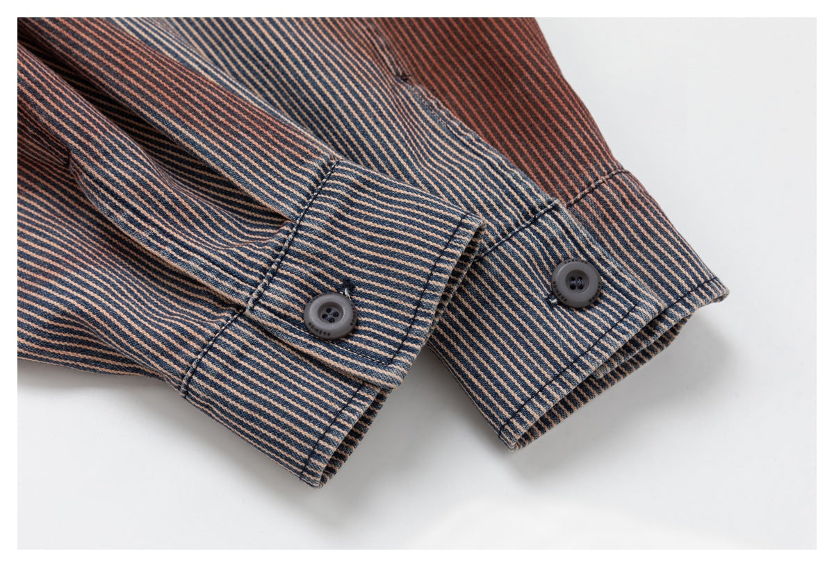 Close-up of two buttoned cuffs on a navy and rust diagonal-striped shirt.