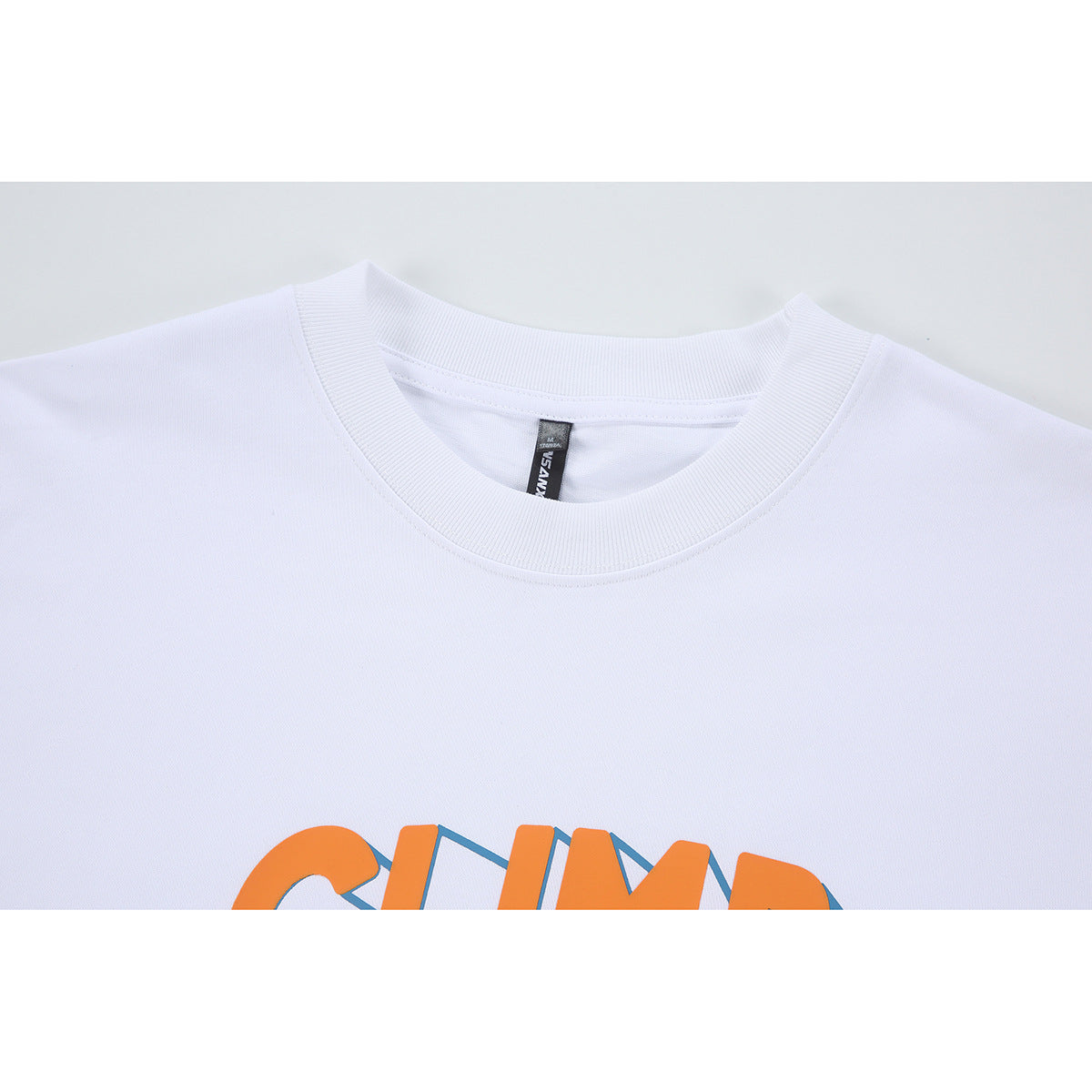 Close-up of a white T-shirt crew neck and collar, with part of an orange and blue chest graphic visible.